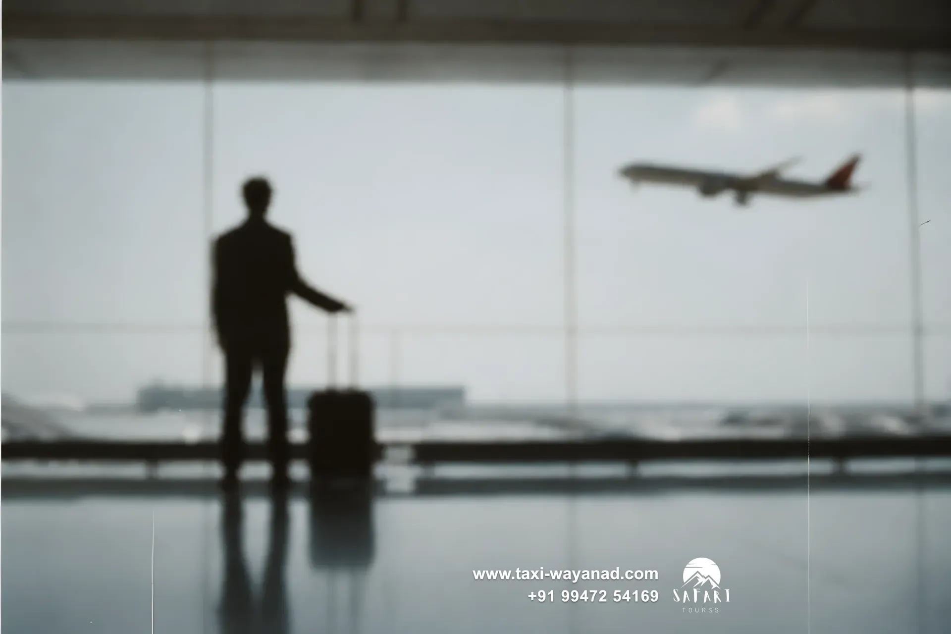 Traveller with a suitcase watching a plane take off: airport transfer taxi to Wayanad